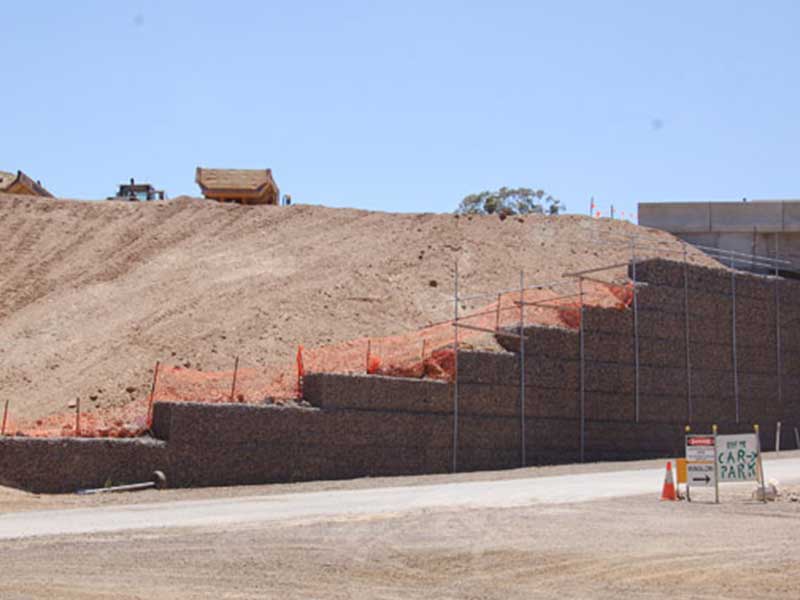 Woven gabion mountain rock surface shotcrete.