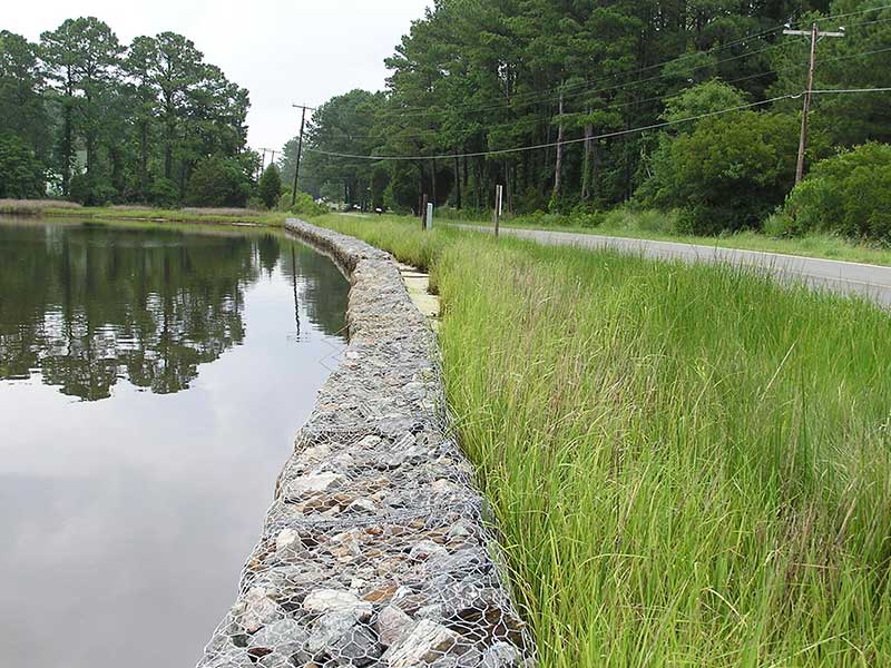 Woven gabion slope support.